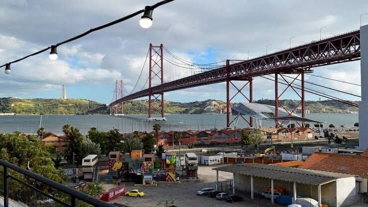 LX Factory warehouse complex in Alcantara Lisbon — converted industrial venue hosting large-scale brand activations and conference after-parties for 500+ guests