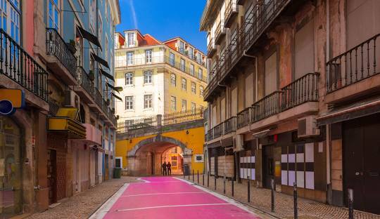 Pink Street in Cais do Sodre Lisbon — pedestrianised nightlife strip with bars restaurants and live music venues used for conference after-parties and networking events