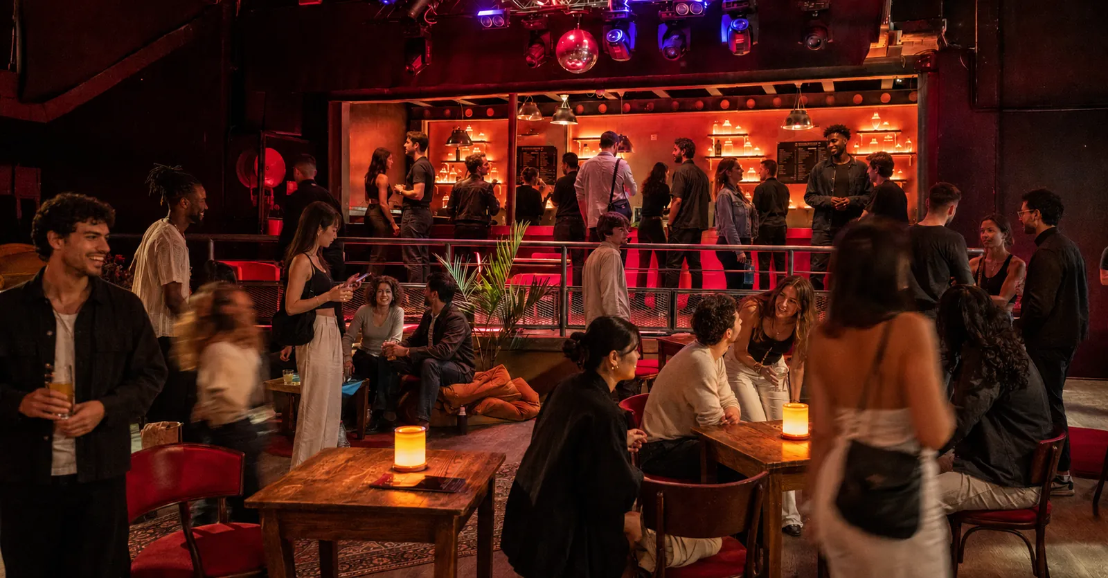 Guests at the StakeDAO burlesque dinner at La Machine du Moulin Rouge in Paris, produced by CH3 Agency
