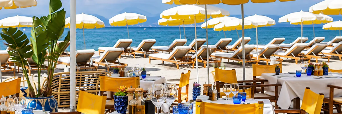 Tables set on the sand at a Croisette beach club in Cannes