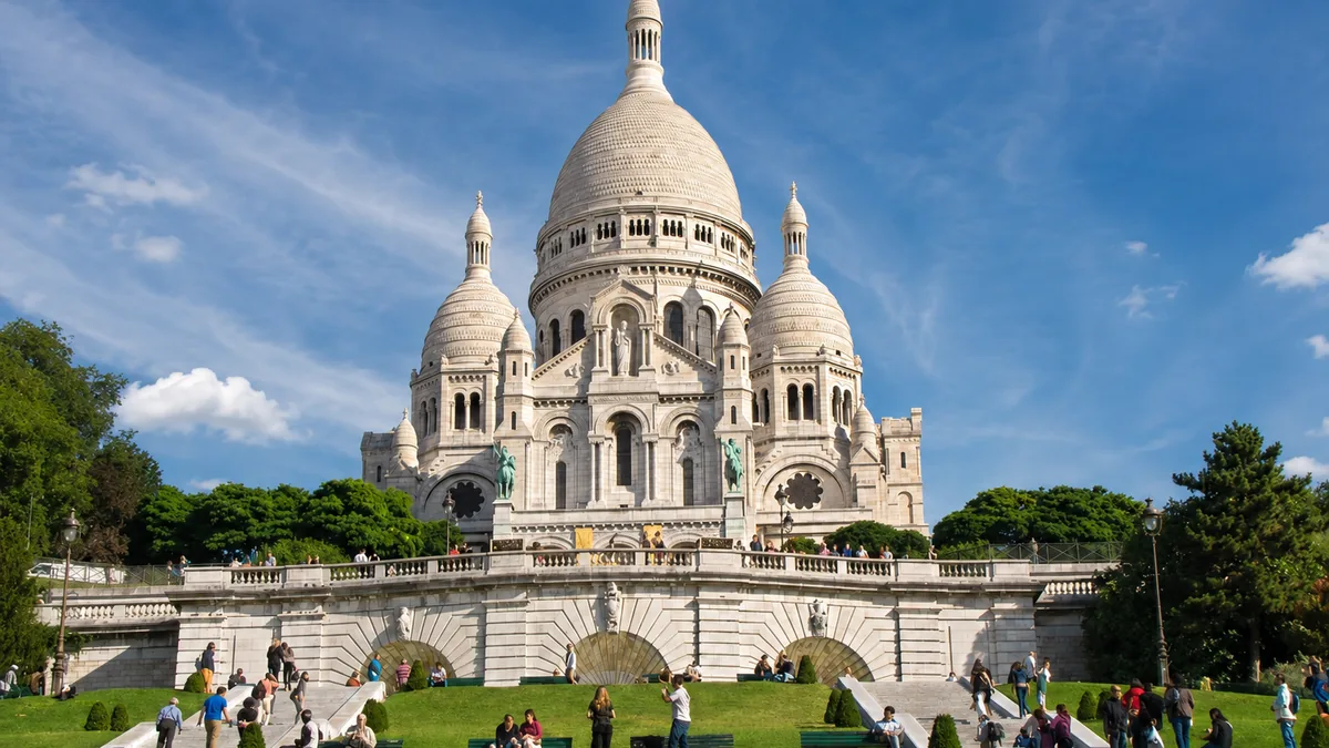 The Sacré-Cœur basilica above the lawns of Montmartre, Paris