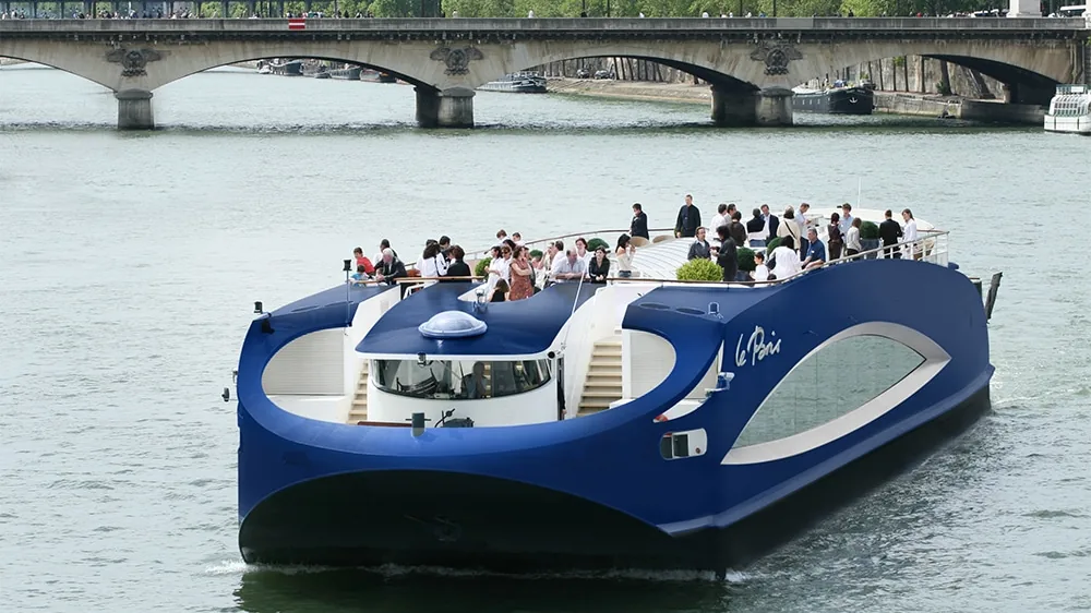 A modern glass-sided event boat on the Seine