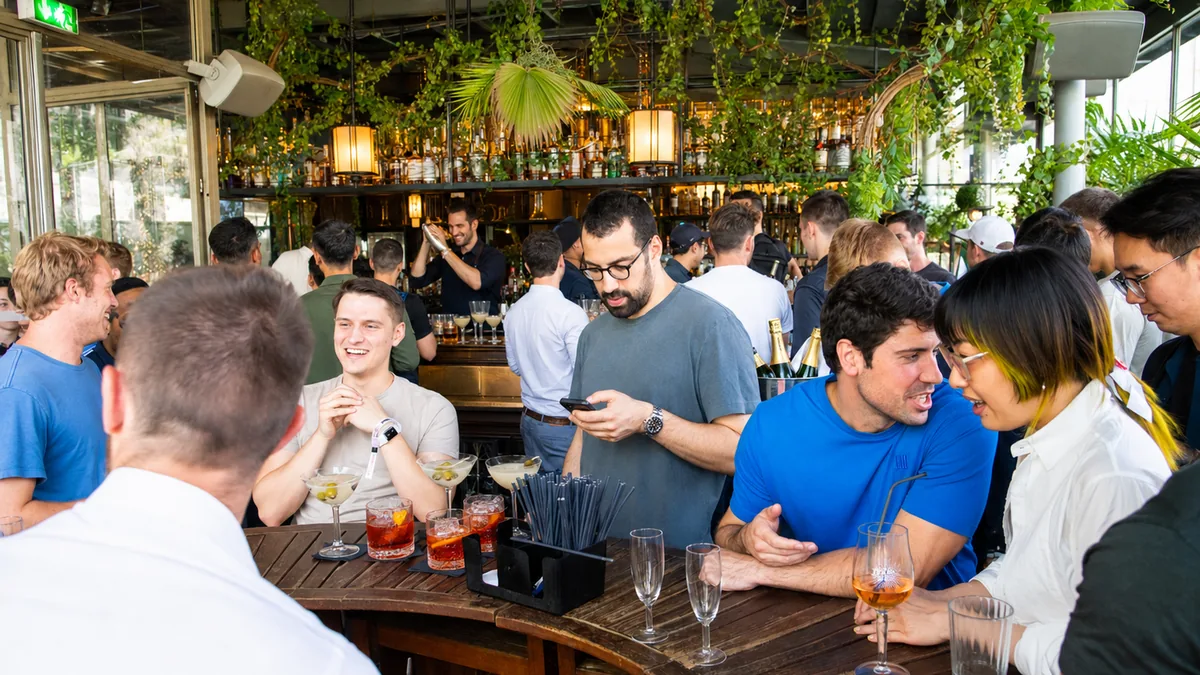 Guests at the bar during Vertex Protocol's cocktail party produced by CH3 Agency in Paris