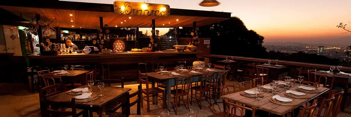 Hillside terrace dining at sunset at Aprazível, Santa Teresa, Rio de Janeiro, Brazil
