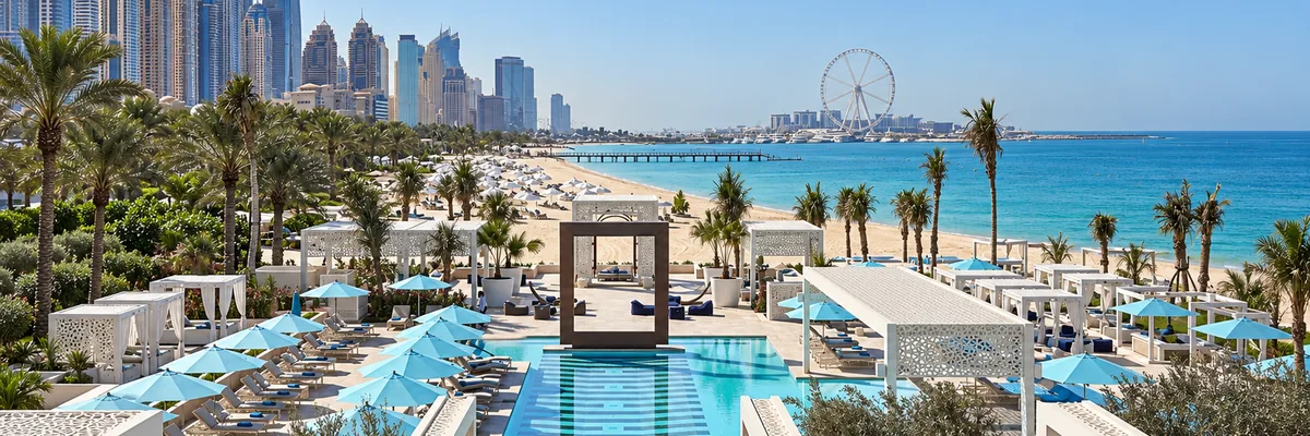 Pool and beach at DRIFT beach club with Dubai Marina skyline, One&Only Royal Mirage, Dubai, United Arab Emirates