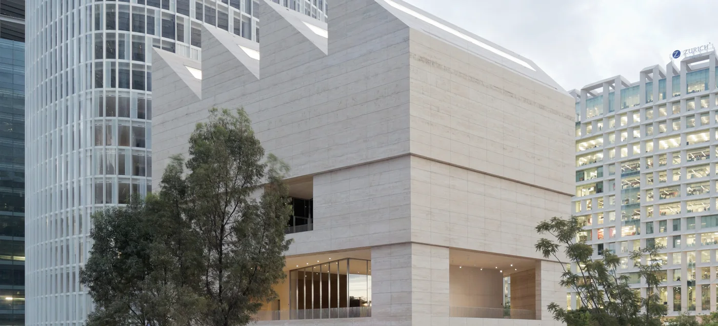 The travertine sawtooth-roofed Museo Jumex on its raised plaza in Polanco, Mexico City
