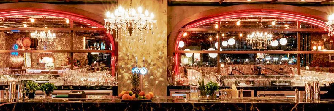 Bar with chandeliers and mirrored ceiling at Papas, InterContinental Dubai Marina, United Arab Emirates