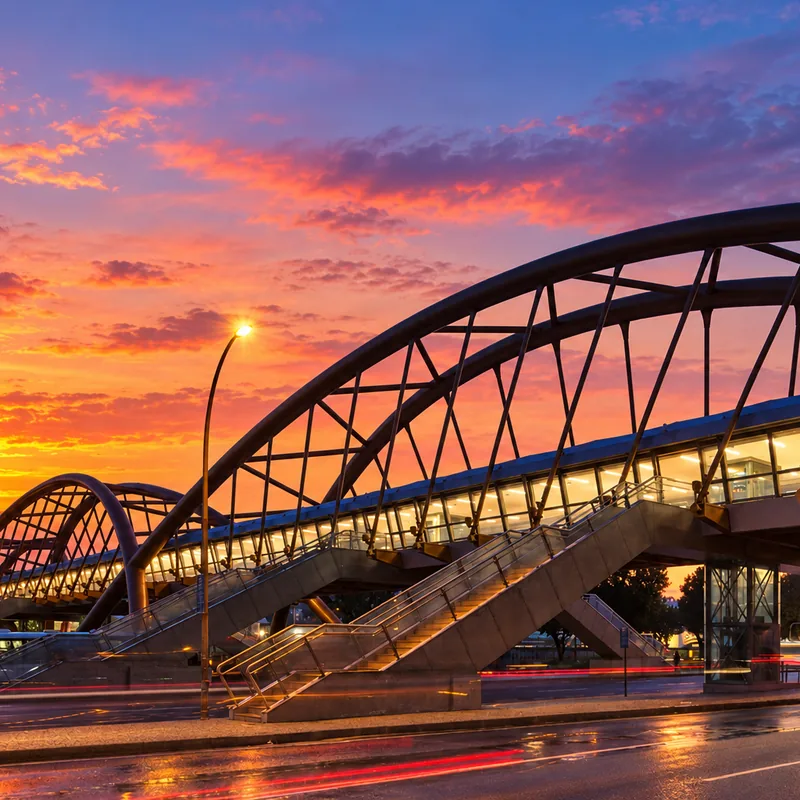 Arched glass footbridge lit at sunset in Cidade Nova, central Rio de Janeiro, Brazil